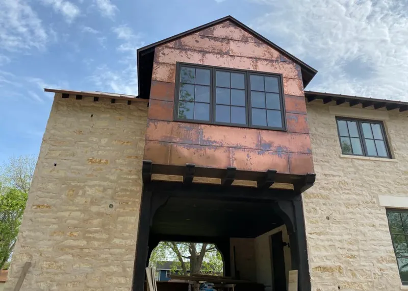 Copper metal panel facade on a stone building for Skylight Installation in Jurupa Valley