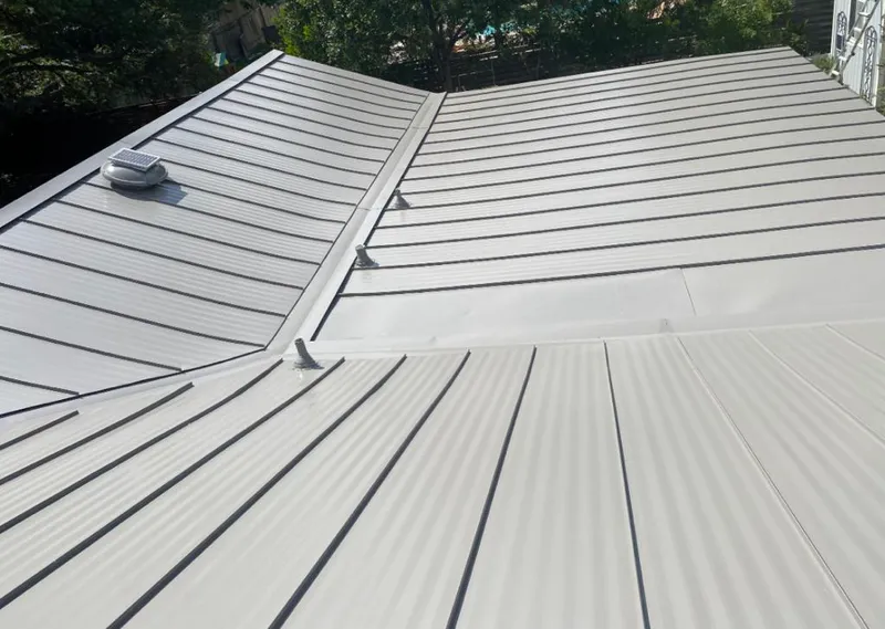 Solar attic fan installed on a metal roof for Roof Ventilation in Jurupa Valley