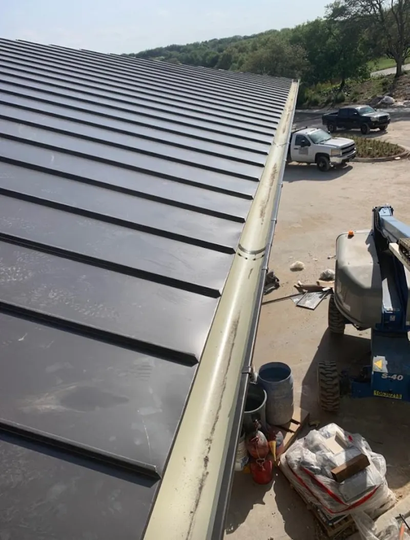 Standing seam panel and gutter detail on a metal roofing jobsite in Jurupa Valley